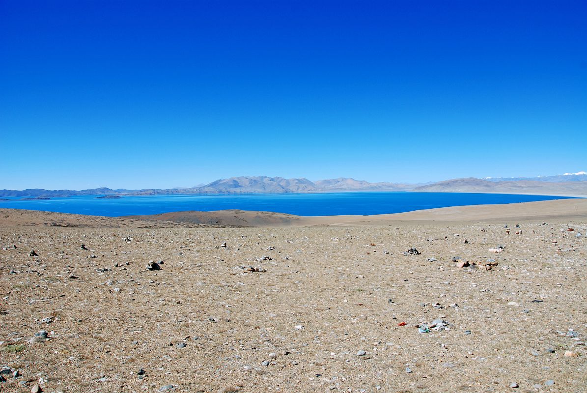 30 Lake Rakshas Tal From Ridge Between Lake Manasarovar And Lake Rakshas Tal To the west of Lake Manasarovar is Lake Rakshas Tal, shaped like a crescent, but thought of as darkness as opposed to the brightness of Manasarovar.